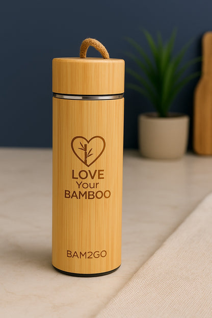 Bamboo water bottle with 'Love Your Bamboo' text on a neutral background